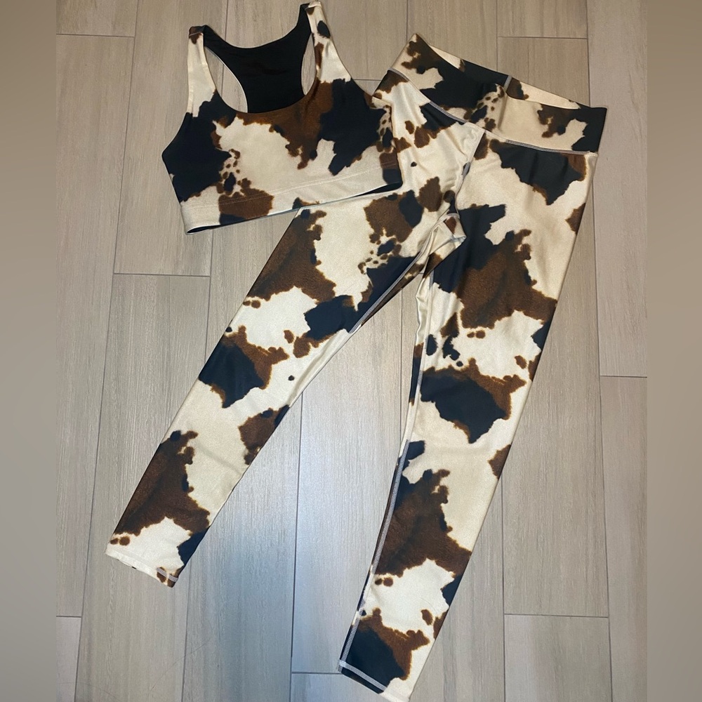 There’s cow print leggings & sports bra set medium